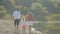 Young family with small children walking along the