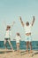 Young family sports on beach, jumping on sand.