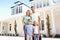 Young Family Standing Outside Dream Home