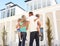 Young Family Standing Outside Dream Home