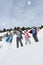 Young Family Throwing Snowballs On Winter Vacation