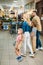 young family with two kids shopping together