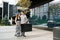 A young family is waiting for the baby. Husband and wife look at each other as they walk through downtown