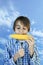 Young farm boy eating boiled corn