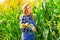 Young farmer girl on corn field.