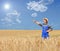 Young farmer pointing in a wheat field