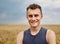 Young farmer in wheat field