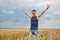 Young farmer in wheat field