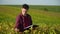 Young farmer writes down the growth rates of soybeans. Concept ecology, bio product, inspection, natural products