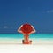 Young fashion woman relax on the beach. Happy lifestyle. White sand, blue sky and crystal sea of tropical beach.