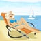 Young fashion woman in swimsuit relaxing on chaise-longue at beach