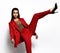 Young fashionable beautiful business woman wear expensive designer stylish red office suit  doing a great stretch kick