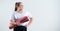 Young fat caucasian woman holding a sport mat. Charming plus size model in sportswear stands on a white background