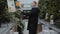 A young father chooses a tree for Christmas. A man buys a fir tree for the new year. Buying a holiday tree for Christmas