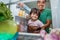 Young father and daughter open refrigerator at home looking for some food