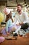 A young father enjoys putting on make-up with his daughter while they prepare for ballet training at home. Family, together, home