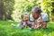 Young father and his son eating strawberries in Park. Picnic. Outdoor portrait