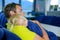 Young father with small daughter sleeping on his shoulder. Lake Te Anau, New Zealand