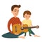 Young father teaches his little son to play the acoustic guitar. Dad playing the guitar with little children
