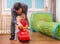 Young father is teaching his child to drive toy car. Daddy is playing with daughter