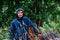 Young father walking with a stroller in a rainy day.