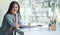 A young female administrative assistant making notes of working planning organizing information in her office