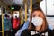 Young female adult commutes in a protective face mask. Coronavirus, COVID-19 spread prevention concept, responsible social