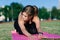 Young female alone at stadium doing yoga