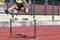 Young female athlete running the obstacle course