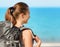 Young female backpacker on a beach