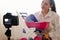 Young female blogger with camera dslr vlogging rewievs baby children toys modern online work