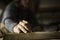 A young female carpenter working as wood designer in a small carpentry workshop. Young business woman handcrafting a piece of