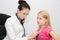 Young female child examined by woman doctor