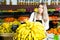 Young female  choosing fresh bananas on the supermarket