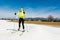 Young female cross country skiing.