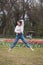 Young female dancer practicing jumps in the park