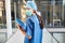 Young female doctor as a surgeon in blue surgical clothing