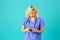 Young female doctor or nurse wearing blue scrub uniform