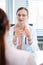 Young female doctor seeing woman patient