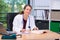 Young female family doctor in her office