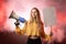 Young female feminist with megaphone promoting feminism