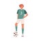 Young female football or soccer player standing with caught ball under her foot. Woman wearing green sports outfit