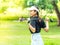 Young female golfer warms up