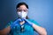 young female healthcare worker making a heart hand gesture