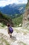 Young female hiker walking in the italian alps
