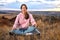 Young female Keep Calm Sitting On Fitness Mat, Meditating Alone On Fresh Air