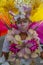 Young female masquerade smiles coyly on during a Carnival Parade in St James Trinidad