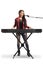 Young female musician playing a keyboard and singing on a microphone