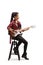Young female musician sitting on a chair and playing electric guitar