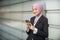 Young Female Muslim Entrepreneur looking at her smartphone.